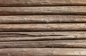 Fototapeta premium Wooden logs wall of old rural house background