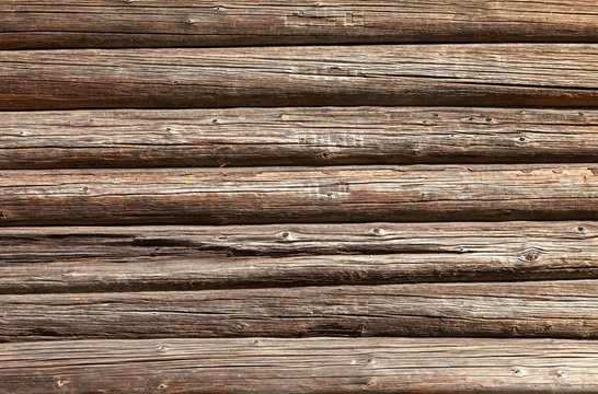 Wooden logs wall of old rural house background