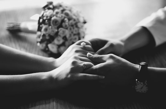 hands of a young wedding couple