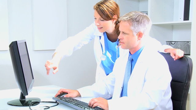 Hospital Medical Consultants Working with Computer