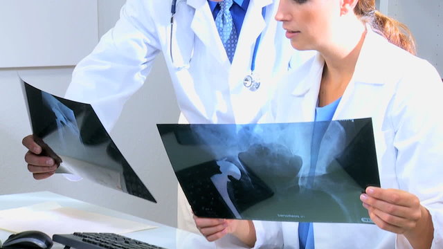 Caucasian Doctor Checking X- Ray Film