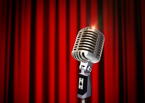 Vintage Microphone Over Red Curtains