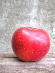 Red apple on grunge background