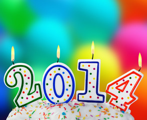 candles with the symbol of the new year on the cake