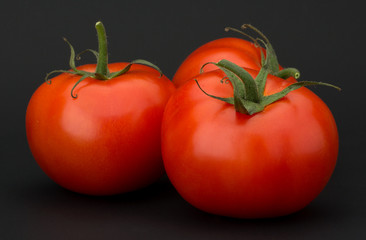 Tomato vegetables isolated on black background