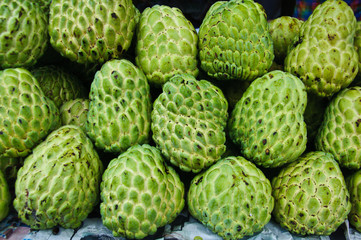 Fresh organic white bulb Custard Apple for sale at a market for