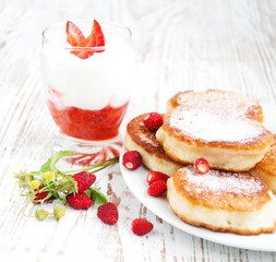 fresh strawberries  pancakes and yogurt
