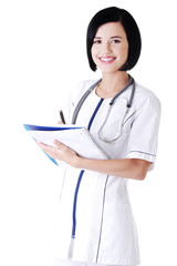 Attractive medicine student or doctor with notebook