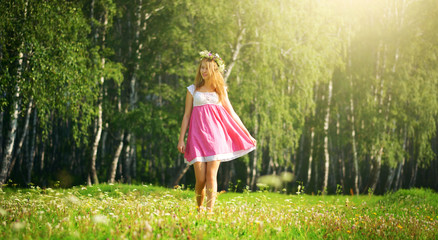 girl walking on meadow