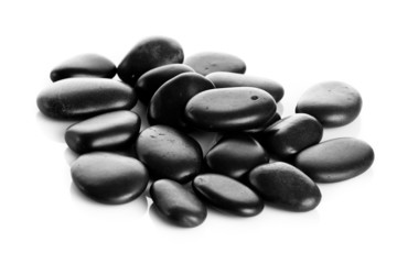 Black massage stones isolated
