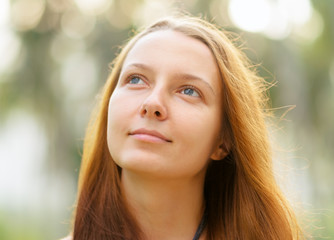 Portrait of young beautiful woman outdoors