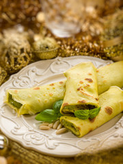 pesto crepes over golden christmas table