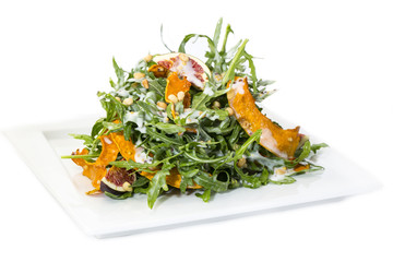 salad of arugula figs and cheese on white background
