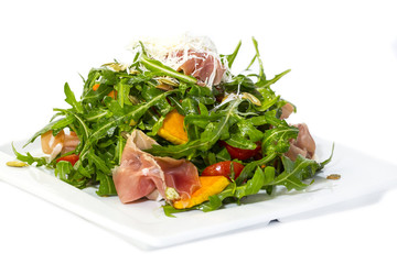 salad of arugula ham cheese on a white background