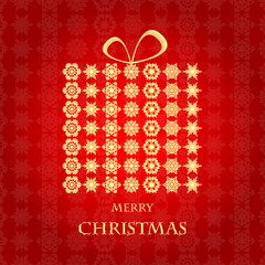 Naklejka premium Christmas background.Gift box made of gold snowflakes on a red b