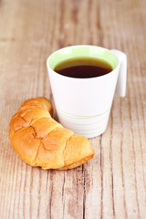 cup of tea and fresh croissant