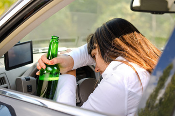 Drunk woman driver passed out in the car