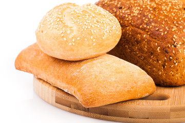 assortment of baked bread isolated on white background