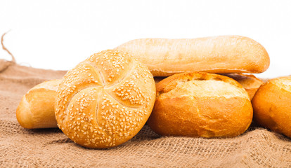 assortment of baked bread isolated on white background