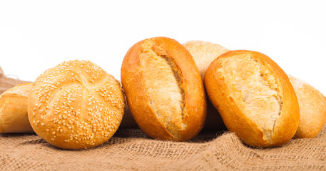 assortment of baked bread isolated on white background