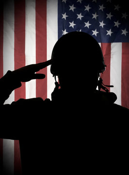 American (USA) Soldier Saluting To USA Flag