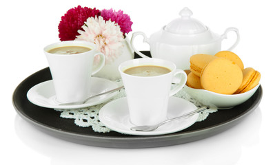 Cups of coffee on tray isolated on white