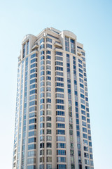 Fototapeta na wymiar Modern Condo Tower on Blue