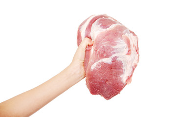 Female hand holding big piece of raw meat