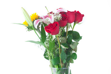 beautiful bouquet of sunflowers, lily and roses in a vase