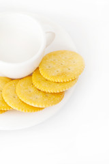 Fototapeta na wymiar white cup with saucer and crackers
