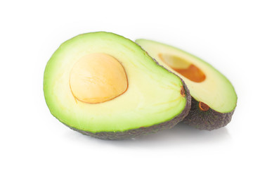 two halves of avocado isolated on white