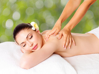 Obraz na płótnie Canvas Woman having massage of body in spa salon