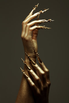 Art Manicure Concept. Golden Hands With Golden Nails