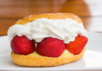 Strawberry cream with bread closeup
