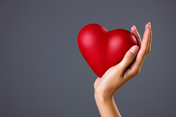 heart on woman`s palm