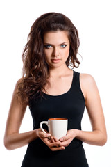 Portrait of lovely brunette woman having cup of tea