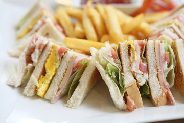 Club sandwich with on wood background