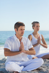 Fototapeta premium Man and woman practicing yoga