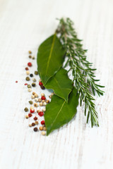 Laurel bay leaves, rosemary and colorful pepper