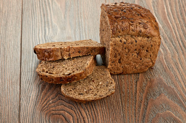 Slices of brown bread on a wooden table