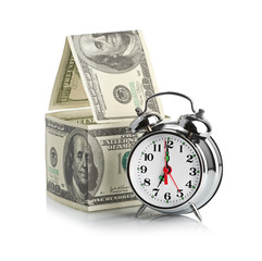 house made of dollars and alarm clock.