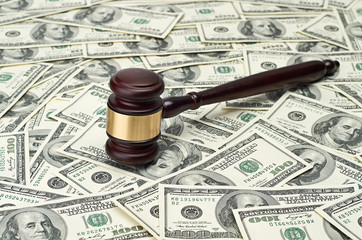 gavel on dollar background