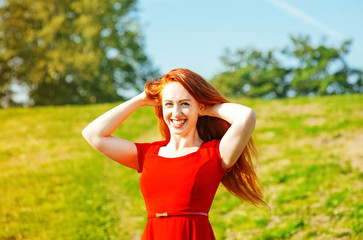 Happy redhead woman outdoor