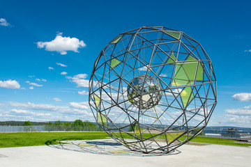 Globe shaped metallic sculpture