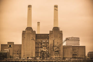 Abandoned derelict Battersea Power Station, London, UK - sepia