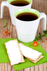 tea and crackers with cream cheese