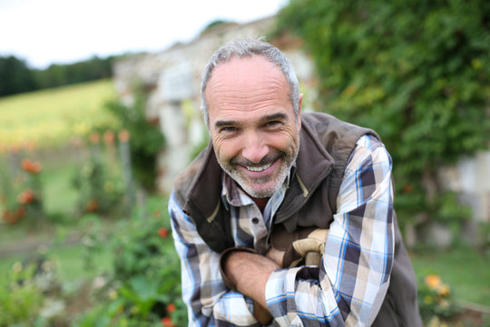 Portrait of senior gardener in vegetable garden