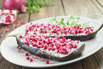 Baked eggplant with cheese, pomegranate and cumin