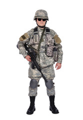 soldier adjusts his cap