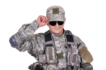 soldier adjusts his cap